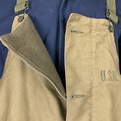 "Vintage United States Navy overalls. Light green fabric. Wool lined. Adjustable straps. Zip closure with button overlay. Four pockets: two at the waist, two on the booty. Straps on ankles to button tighter. USN marking on chest. Measurements (taken flat) ~ Size: large Length (top of chest to ankle): 50\" Chest: 22\" Waist: 24 1/2\" Inseam: 28\" PLEASE READ Condition: good Age appropriate signs of wear throughout. Some light staining. Zipper is broken/torn a couple inches from bottom of fly. Top Utility Bib Front Bottoms With Pockets, Military Overalls With Pockets For Outdoor, Military Style Green Overalls With Pockets, Military Green Overalls With Pockets, Utility Style Overalls With Belt Loops, Utility Overalls With Belt Loops, Light Green Fabric, Vintage Overalls, Fabric Wool