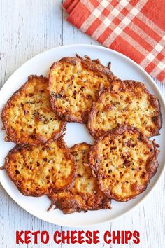 keto cheese chips on a white plate next to a red and white checkered napkin