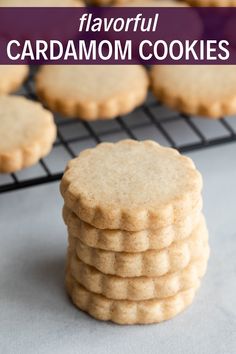 a stack of cookies sitting on top of a cooling rack with the words, flavorful cardamom cookies