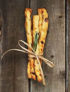 bread sticks wrapped in twine and tied with string