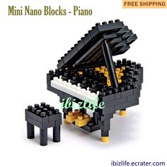 a black and white toy piano sitting on top of a table