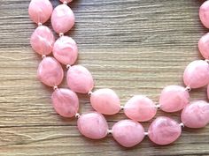 "A classic neutral that never goes out of style! Each bead is one of a kind, and has swirls of multi-toned pinks and white. Each bead has a \"stained glass\" look - very chic and elegant. This is part of our \"Magnolia Necklace Collection\". Love this style but prefer a different color? Check out the rest of the collection here: https://www.etsy.com/shop/PolkaDotDrawer/search?search_query=Magnolia Necklace is 16 inches long with a 4 inch extender chain. Earrings are 2\" drop. Bracelet is a 7\" s Pink Faceted Beads Jewelry For Formal Occasions, Pink Formal Jewelry With Faceted Beads, Pink Round Beaded Necklaces For Party, Pink Beaded Necklaces For Party, Elegant Pink Beaded Necklace With Gemstone Beads, Elegant Pink Gemstone Beaded Necklaces, Elegant Pink Rose Quartz Beaded Necklaces, Elegant Pink Rose Quartz Beaded Necklace, Elegant Pink Beaded Necklaces With Oval Beads