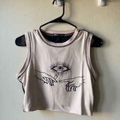 Cream Colored Tank Top With Eye And Hand Print. The Back Is Completely Black. Never Worn Before, Brand New!! Very Strong And Thick Material Beige Sleeveless Top With Graphic Print, Thrifting Clothes, Nike Hoodie Outfit, Black Lace Corset Top, Arte Aesthetic, Clothes Board, Black Lace Corset, Lace Corset Top, Thrifted Outfits