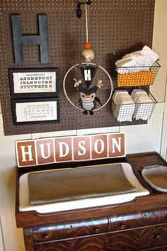 there is a clock on the wall with letters and numbers above it that read hudson