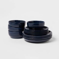 a stack of blue dishes sitting on top of each other