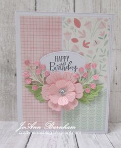 a birthday card with pink flowers and green leaves