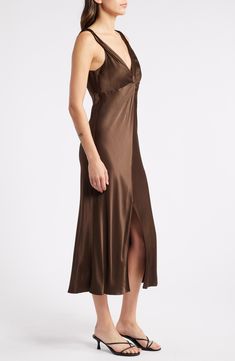 A front knot creates a shapely gathered effect on this slinky satin midi complete with a leggy front slit that makes it perfect for an elevated night-out look. 35" - 49" length (size Medium) Back zip closure V-neck Sleeveless Unlined 55% rayon, 45% viscose Dry clean Imported Satin Midi Dress, Nordstrom Dresses, Night Out, Knot, Dry Clean, Midi Dress, Nordstrom, Size Medium, Satin