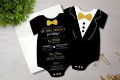 a black and gold baby shower with a tuxedo on the front, yellow bow tie