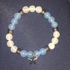 Never Worn! Blue And White Bracelet With Starfish Charm Blue Bracelets With Starfish Charm Ocean-inspired, Ocean-inspired Blue Starfish Bracelets, Casual Blue Jewelry With Starfish Charm, Blue Starfish Bracelets For Summer, Casual Blue Beaded Bracelets With Starfish Charm, Sea Bead Bracelets, Coastal Bracelet, Blue And White Bracelet, Beading Bracelets