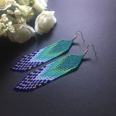 "These turquoise long fringe bead earrings pair amazingly with any outfit, dressy or casual. They are made of high-quality Czech colored beads with steel . Colors: turquoise gold green blue Length: 5.1 inches (13 cm) Width: 1 inches (2.5 cm) Materials: Czech \"Preciosa\" beads Durable synthetic thread" Elegant Turquoise Tassel Earrings With Fringe, Elegant Turquoise Tassel Fringe Earrings, Blue Beaded Fringe Tassel Earrings For Summer, Elegant Turquoise Earrings With Fringe, Elegant Blue Fringe Jewelry, Blue Beaded Fringe Earrings For Summer, Summer Blue Beaded Earrings With Tassels, Summer Blue Beaded Earrings With Fringe, Blue Long Drop Tassel Jewelry