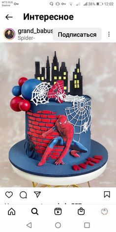 a spiderman cake on top of a table