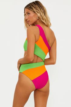 An update to the crowd favorite, the Celine now with fun colorblocking in our ultra-soft ribbed fabric. This asymmetrical one-piece swimsuit has a side cutout and moderate coverage. Chic and new, she has become one of our bestsellers. Perfect for any activity, from lounging poolside to swimming in the ocean. Featuring our new Neon Sunset Colorblock which features vibrant shades of fuchsia pink, orange and vivid lime green. Neon Sunset, Swimming In The Ocean, Tennis Shop, Festival Shop, One Piece Swim, Kids Swimming, Fuchsia Pink, In The Ocean, Swim Bottoms