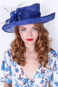 Soak up the sun in the chicest, vintage-styled sun hat. This hat has a slightly flipped brim silhouette, large mesh petals that make a statement not to be messed with and topped off with a delicate feather flower. This glam style features day-to-dark versatility for the perfect derby queen look! High Tea Hats, Royal Blue Fascinator, Mesh Flowers, Easter Bonnets, Kentucky Derby Style, Flowers And Feathers, Tea Hats, Barbie Hat, Blue Fascinator