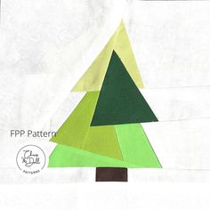 a piece of paper with a green and yellow christmas tree on it