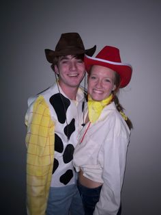 a man and woman dressed in costumes posing for a photo together, one wearing a cowgirl costume