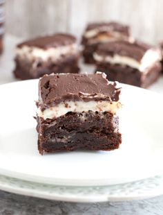 two pieces of chocolate cake on a white plate