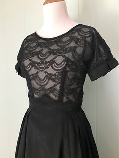 "* 1950s black cocktail dress * full pleated taffeta skirt * pointed inverted basque waist * sheer double layer lace bodice * short sleeves with taffeta cuffs and bows * scoop neck * low v-back * back metal zipper with series of hooks and eyes ✂ Measurements Bust: 36\"-37\" (dolman sleeves) Waist: 23\"-23.5\" (maybe a very snug 24\") Hips: free Shoulder to waist: 15\" Waist to hem: 26.5\" Length: 41.5\" Fits like: extra small Condition: Good. Some small breaks in the lace on the bodice - these w Evening Dress With Accordion Pleats And Full Skirt, Accordion Pleated Full Skirt Party Dress, Full Skirt Dress With Accordion Pleats For Party, Black Accordion Pleats Party Dress, Fitted Black Dresses With Accordion Pleats, 1950s Style Fit And Flare Party Dress, Party Dress With Pleated Skirt And Fitted Bodice, Chic Short Sleeve Vintage Party Dress, Chic Vintage Short Sleeve Party Dress