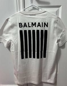 Welcome to my shop where luxury meets affordability! 100% Cotton Material Balmain Limited Edition Quality Tee. Wash Tag Cut from Manufacturer  Check the size Info before placing the order. small chest :- approx 47cm Medium chest :-  approx 51cm Large chest :- approx 54.5cm 2XL chest :- approx 58.5cm Important: Please Verify Size Measurements Prior to Purchase All Sales Are Final - Your Satisfaction is Our Priority Thank you for shopping with us! We work diligently to provide detailed description Logo Black, Fashion Mens, White T, Mens Clothing, Logo Tees, Print Logo, White T Shirt, Black T Shirt, Vintage Tees