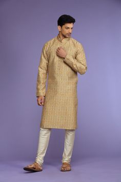 Mustard Yellow or Navy Abstract Printed Blended Kurta Set Traditional  Wear  Care Instructions: Dry Clean Blended Benarasi silk kurta with motifs & front potli placket. Top Details: Color- Mustard Yellow or Navy, Fabric - Blend slik Bottom Details Color - Cream, Style - free size Chudidar, Fabric -Dhupion Silk Package Include: Kurta and Pajama Additional Information : - As this Sherwani/Waistcoat/Kurta is stitched & made as per orders requested only, So there is NO RETURN & NO EXCHANGE on this p Gold Chanderi Sherwani For Wedding, Gold Semi-stitched Chanderi Sherwani, Gold Silk Sherwani For Eid, Gold Silk Bollywood Sherwani, Gold Jamawar Kurta With Resham Embroidery, Gold Silk Kurta With Dabka Detail, Gold Silk Kurta With Dabka, Gold Traditional Wear For Eid, Traditional Gold Wear For Eid