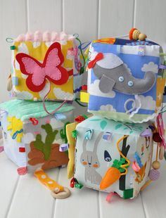 several colorfully decorated bags sitting on top of each other