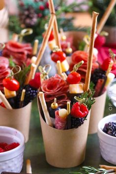 small cups filled with food on top of a table