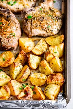 chicken, potatoes and parsley on a sheet pan