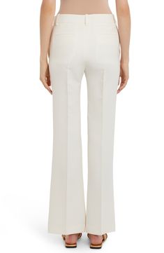 Exquisite elegance pervades crisply creased pants fashioned from a well-balanced wool-and-silk blend. Zip fly with button closure Front slant pockets; back welt pockets 65% wool, 35% silk Dry clean Made in Italy Women's Designer Clothing Elegant Formal Wide-leg Pantsuit, Elegant Silk Wedding Pants, Luxury White Pants For Wedding, Luxury White Bottoms For Evening Wear, Luxury White Bottoms For Evening, Luxury White Evening Pants, Elegant Spring Wedding Pants, Chic Full-length Wedding Bottoms, Chic Full Length Wedding Bottoms