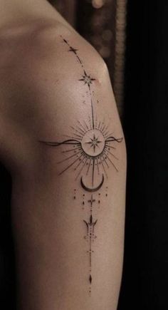 a woman's arm with a sun and moon tattoo on the left upper arm