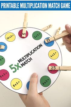 a number match game with wooden pegs in the middle