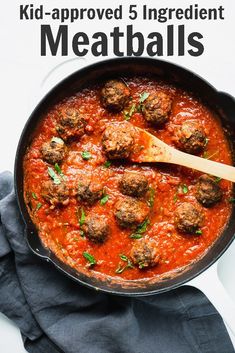 a skillet filled with meatballs and sauce