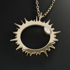 Also available without diamonds and sterling silver﻿. Solar eclipse corona jewelry Introducing the eclipse collection to commemorate the total solar eclipse of 2024. Featuring the solar corona and the "diamond ring" effect. About this piece This pendant necklace is made of 14K solid gold and marquise-cut diamonds. The charm is available in two sizes: 5/8" (16mm) and 7/8" (23mm). The necklace comes with a 16-18" length adjustable gold chain (other lengths available). Optional complementary engrav Elegant Diamond Sun And Moon Jewelry, Elegant Diamond Jewelry With Sun And Moon Design, Diamond Pendant With Diamond Eyes, Celestial Sterling Silver Necklace With Single Cut Diamonds, Solid Gold Charms, Space Jewelry, Total Solar Eclipse, The Eclipse, Marquise Cut Diamond