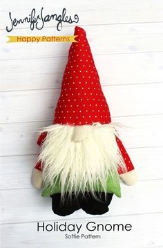 a red and white christmas gnome ornament hanging on a wooden background with the text happy gnomes holiday gnome softie pattern