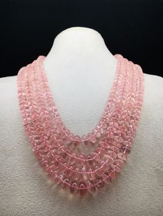 100% Natural Rose Quartz smooth rondelle shape beaded necklace with adjustable silk cord closure.  Details: - Gemstone - Rose Quartz Shape - Rondelle Gross weight - 1073.75 carat Net weight - 1033.00 carat Length - Inner - 15 inches, Outer - 19 inches Calibration of beads - 8.00 millimeters till 14.00 millimeters SKU - HJSPSAR0033 100% NATURAL ROSE QUARTZ AMAZING NECKLACE UNIQUE NECKLACE PINK COLOR NECKLACE Thank you for your kind visit to my shop. NOTE: - You will receive the same product you see in the picture.   Dear Buyers, please feel free to ask questions    We will be glad to answer & solve query regarding this product RETURN POLICY: -   Every piece of jewelry and inputs ( gemstones, diamonds, making, and setting) is tested by our team of experts and experienced  artisans to generat Luxury Pink Briolette Necklace, Pink Round Gemstone Beaded Necklace, Rose Quartz Necklace With Faceted Round Beads, Rose Quartz Faceted Beads Necklace, Elegant Rose Quartz Round Crystal Necklaces, Pink Polished Round Bead Necklaces, Pink Round Polished Bead Necklaces, Elegant Pink Beaded Necklace With Gemstone Beads, Elegant Rose Quartz Round Crystal Necklace