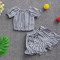 2-piece Stripes Pattern T-shirt & Shorts for Toddler Girl - PrettyKid Cute Matching Set Tops For Vacation, Cute Striped Cotton Sets, Black Summer Sets For Playwear, Playful Short Summer Sets, Spring Beach Striped Sets, Summer Playwear Set With Shorts, Summer Playwear Set Shorts, Summer Matching Set With Short Sleeves, White Matching Set For Summer