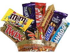 a basket filled with assorted candy bars