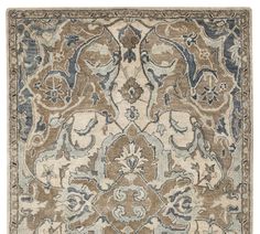 a rug with an ornate design on the front and back side, in grey tones