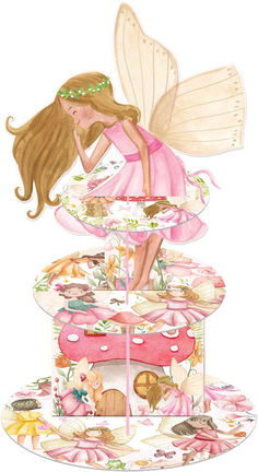 a card with a fairy sitting on top of a cake