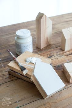 some wood blocks and paint on a table