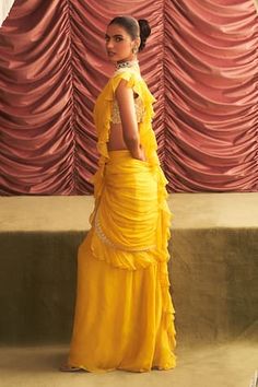 Yellow pre-draped ruffle saree with mirror-bead embellished borders. Comes with floral mirror-bead embellished cut-out blouse. - Aza Fashions Traditional Pre-draped Saree With Ruffles, Draped Pallu Dress For Festivals, Festival Draped Dress With Pallu, Festive Yellow Ruffled Dress, Pre-draped Saree With Ruffles For Festivals, Floor-length Ruffled Dresses For Festivals, Fitted Ruffle Dress For Diwali, Fitted Ruffled Dresses For Diwali, Ruffle Saree