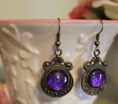 Small Round Charm Earrings  Sparkle by StarBucketDesigns on Etsy Purple Metal Earrings As Gift, Purple Metal Earrings For Gift, Antique Finish Copper Earrings As Gift, Purple Brass Earrings As Gift, Vintage Iridescent Earrings For Gift, Hand Painted Earrings, Painted Earrings, Small Charms, Sparkle Earrings