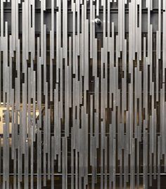 an abstractly designed metal screen is shown