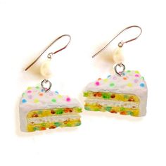 "These Funfetti Cake Earrings are a perfect handmade cute charm jewelry birthday gift for your best friend or any woman in your life! Perfectly festive and kawaii, this confetti cake pendant is made from resin and hangs below hypoallergenic surgical steel earrings perfect for sensitive ears. Includes free pink and holographic logo gift box! Matching necklace: https://www.etsy.com/listing/240684572/confetti-cake-necklace-funfetti-birthday?click_key=63ed1996739b1cbfbb30143c69723f3e13726fb2%3A240684572&click_sum=dfd597fa&ref=shop_home_feat_2&sts=1 Style & Details: -Handmade and hand painted resin funfetti cake charms featuring realistic cake and frosting texture and tiny rainbow sprinkles! -Choose your favorite style from the drop down menu: with glass pearls, with bows with swarvoski crystal Birthday Cake Slice, Funfetti Birthday Cake, Funfetti Birthday, Holographic Logo, Moist Yellow Cakes, Kawaii Birthday, Cake Earrings, Realistic Cakes, Birthday Gift For Friend