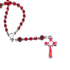 Handmade Catholic Rosary -Small, light Siam (red) glass beads, swirled red beads with blue and yellowish gold swirls.AVE (Hail Mary Beads): 6 mm, Czech light Siam red fire polished glass beadsPATER (Our Father Beads): 8 mm, red swirl glass beadsCROSS: Approx. 2", red enamel inlay, silver tone metal St. Benedict crucifixCENTERPIECE: Miraculous Mary LENGTH: 17 inches Also known as Dominican Rosary and Holy Rosary. The St. Benedict medal serves as protection against evil and temptation, secures a t Benedict Medal, Holy Rosary, St Benedict, Catholic Rosary, Our Father, Red Beads, Hail Mary, Rosary Catholic, Red Bead