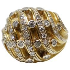 Add this stunning ring to your collection! Circa mid-20th century, this 14k Gold dome ring features asymmetrical rows of surface prong set Diamonds and flush/bezel set Diamonds. Ring weighs 12.26g total and was made to fit a size 6. Perfect to slip on for a night out with your favorite vintage Hermés look and Van Cleef & Arpels necklace! Luxury Dome Ring With Diamond Accents As Gift, Luxury Open Dome Ring With Diamond, Luxury Concave Dome Ring For Anniversary, Luxury Dome Ring For Anniversary, Round Shape, Luxury Diamond Cut Dome Ring For Formal Occasions, Luxury Domed Rings With Diamond Accents, Luxury Diamond Dome Ring For Formal Occasions, Van Cleef Arpels Necklace, Gold Dome Ring