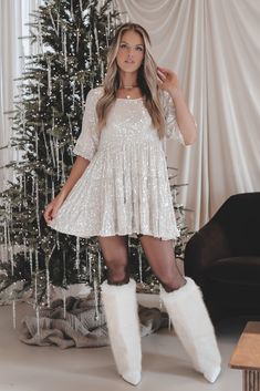 Made of white faux leather, these statement knee high boots feature a chic pointed toe and a fold-over faux fur shaft. Perfect for any occasion, these boots add a touch of luxury to any outfit. Heel height is 4” True to size Sequin Babydoll Dress, Wedding Guest Romper, White Babydoll Dress, Party Bottoms, Baby Doll Dress, Stiletto Boots, White Faux Fur, Maxi Dress Party, Western Dresses