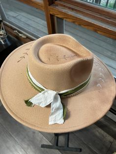 Discover the rugged charm of our Burned Western Hat. This unique, handcrafted cowboy hat features a distressed look, giving it a vintage, well-worn appeal perfect for Western enthusiasts and fashion-forward individuals. Features: Handcrafted Design: Each hat is meticulously burned and distressed to achieve a one-of-a-kind look. Premium Materials: Made from high-quality materials for durability and comfort. Unique Aesthetic: The burned finish adds a distinctive vintage style that sets it apart. B Rustic Wide Brim Hat For Kentucky Derby, Rustic Adjustable Felt Hat For Kentucky Derby, Rustic Hat For Kentucky Derby And Country Events, Rustic Wide Brim Hat Bands For Kentucky Derby, Rustic Hats For Country Events And Kentucky Derby, Rustic Wide Brim Fedora For Country Events, Rustic Wide Brim Hat, Bohemian Beige Felt Hat For Country Events, Rustic Wide Brim Felt Hat For Kentucky Derby