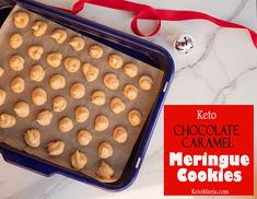 keto chocolate caramel meringue cookies in a baking pan with red ribbon