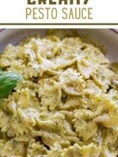 creamy pesto sauce in a white bowl with basil leaves on top and text overlay