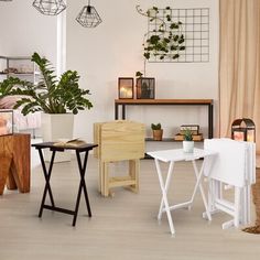 a living room filled with lots of furniture next to a wooden table and planter