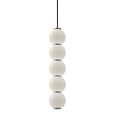 a white light hanging from a ceiling fixture with five balls on the bottom and one ball at the top